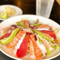 Spicy Seafood Salad · Assorted sliced raw fish with mixed salad and spicy sauce.