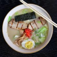 Tonkotsu Ramen · Ramen noodles in pork base broth served with slices of pork belly, boiled egg, cabbage, red ...