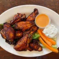 BBQ Chicken Wings · BBQ style. with carrots, celery, and zesty citrus dip and thick blue cheese dressing