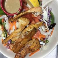 Catfish Salad · Fried or blackened catfish strips fried in cracker meal on top an extra big field greens sal...