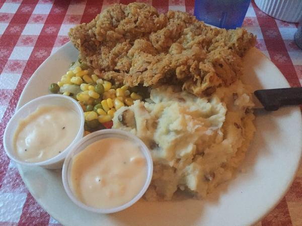 Chicken Fried Steak · Our #1 seller!! A pounded Angus steak that's batter-fried and topped with our creamy gravy. Served with mashed potatoes and veggies.