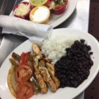 Marinated Chicken Fajitas · With peppers, onions and tomatoes. served with
guacamole, pico de gallo, jack cheese, and so...