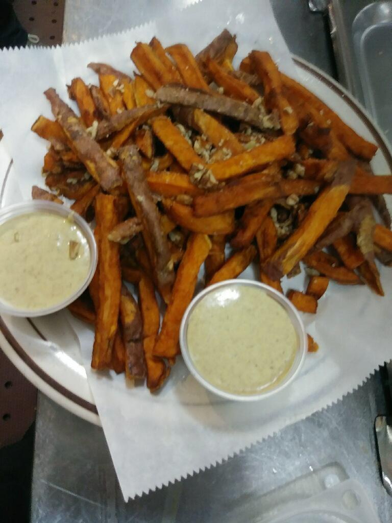 Sweet Potato Fries · Served with a creamy pecan honey sauce, sprinkled with chopped pecans. Extras/Additions to order must be done in sides category. Items added without a price will not be honored.