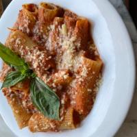 Rigatoni Bolognese · Giuseppe cocco rigatoni gigante pasta, house-made bolognese, and Grana Padano.