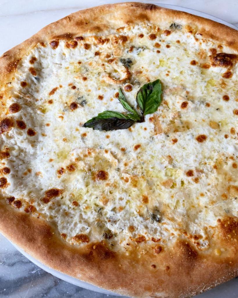 Quattro Formaggi Pizza · Gorgonzola, provola, fresh mozzarella, basil, and Grana Padano.