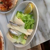 Caesar Salad · Romaine hearts, Caesar dressing, anchovies, Grana Padano, and house-made croutons.