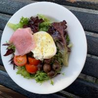 Della Casa Salad · Seasonal greens, fresh mozzarella, cherry tomatoes, olives, and choice of prosciutto cotto o...