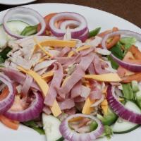 Chef's Salad · romaine lettuce, turkey, ham, cheese, tomato, cucumber, beans, onions, croutons, and hard bo...