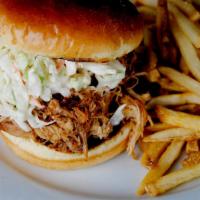 Pulled Pork with Coleslaw Sandwich · Sandwich made from shredded slow cooked meat.