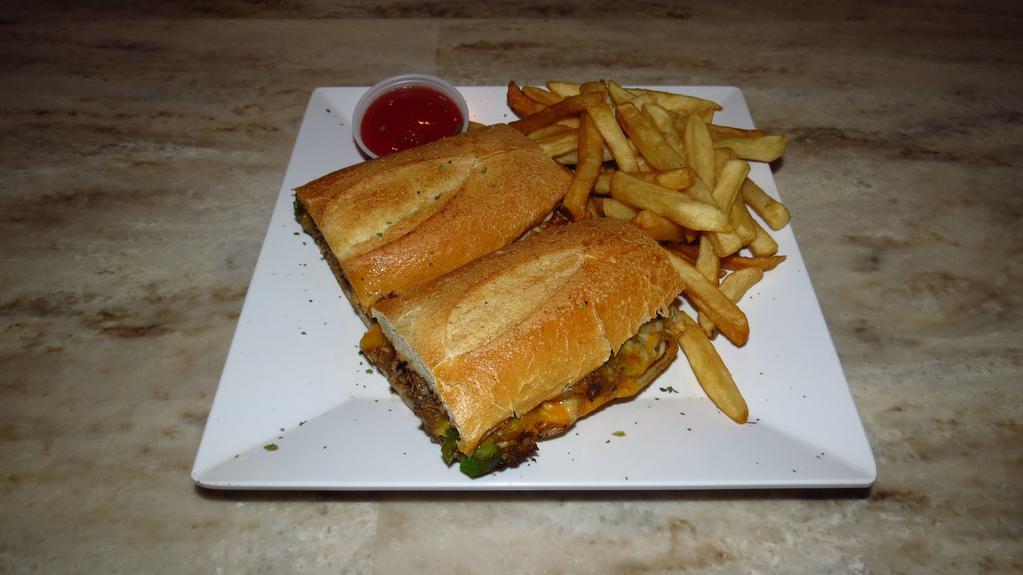 Philly Cheesesteak Sandwich · Shaved steak grilled with onions and green peppers topped with mayo and cheddar cheese.