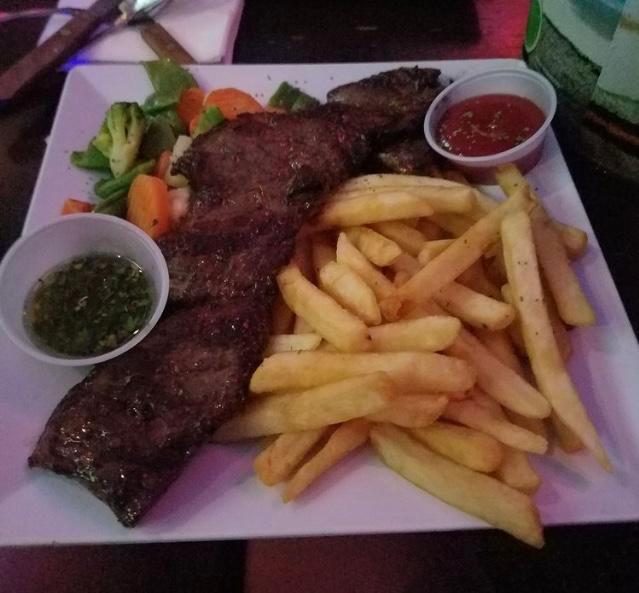 10 oz. Tropix Skirt Steak · Delicious center cut skirt steak served with french fries and sauteed vegetables with a homemade chimichurri sauce.