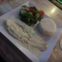 Sauteed Filet of Fish · Pan seared white fish with a sweet mild taste sauteed in a white wine cream sauce served wit...