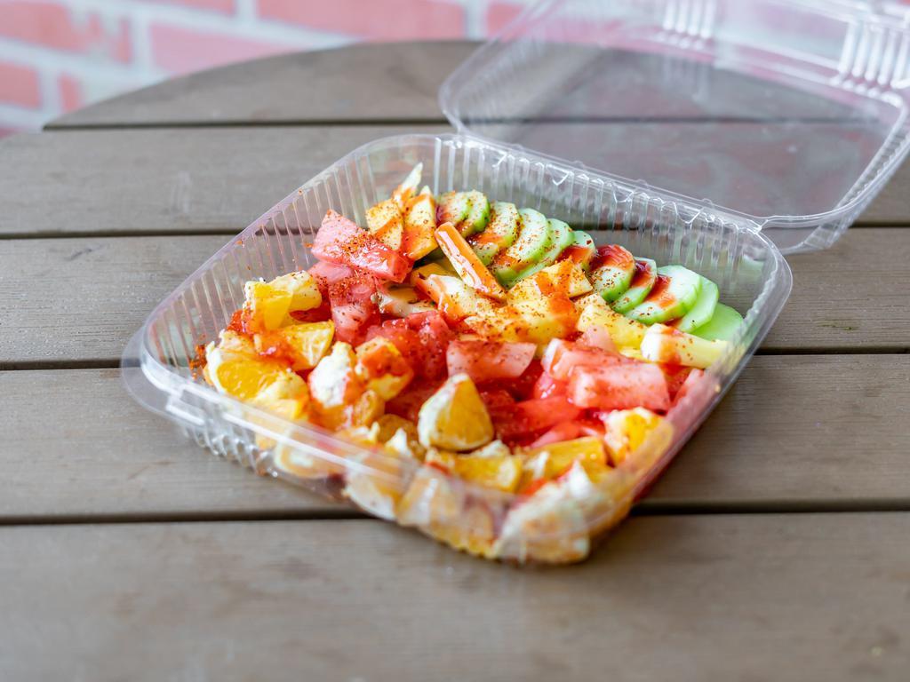 Pico de Gallo de Frutas · Cucumbers, Oranges, Pineapple and Watermelon topped with chamoy, tajin and lime.