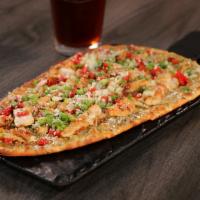 Baja Chicken Flatbread · Pepper Jack & cotija cheeses, fire roasted red peppers, poblano sauce, scallions, onion & ci...
