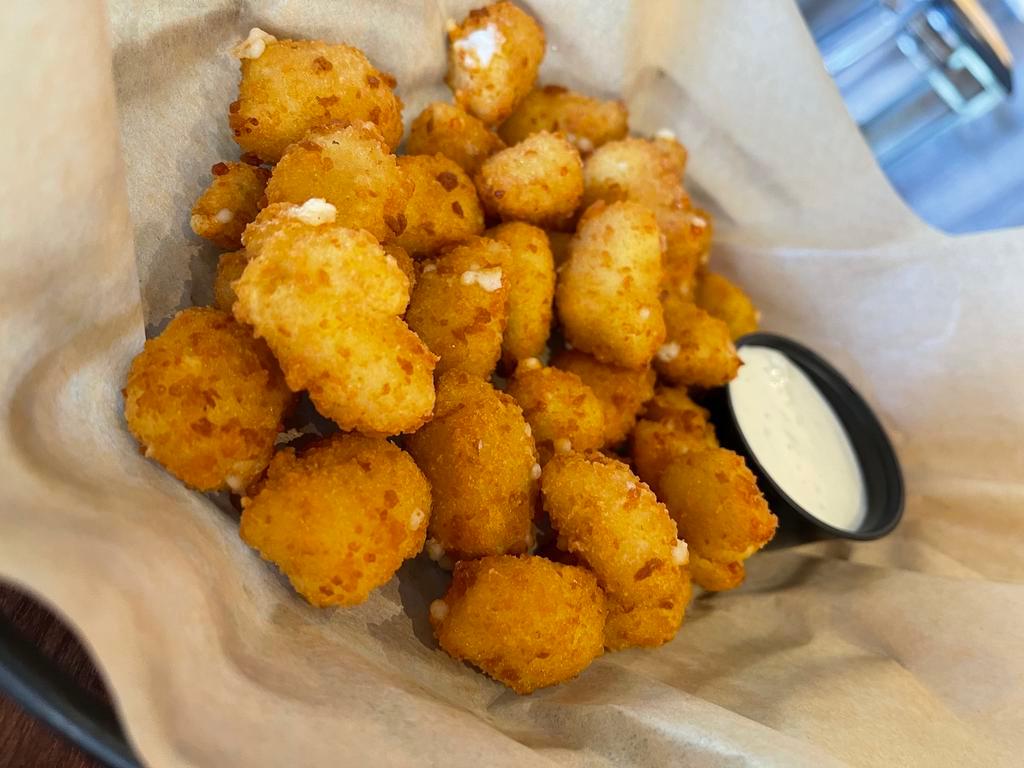Cheese Curds · Lightly breaded & fried with side of house-made buttermilk ranch.