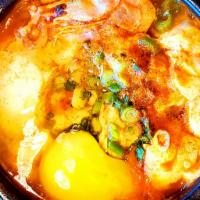 4. Soon Dubu Chigae 순두부 찌개 · Soft tofu, egg, mushroom and choice of seafood, pork or beef prepared in spicy soup.