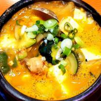 6. Doen Jang Chigae 된장찌개 · Soybean paste soup with variety of vegetables seafood and tofu.