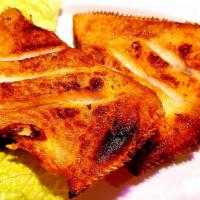 26. Ga Ja Mi Gui 가자미 구이 · Fried yellowfin sole fish.