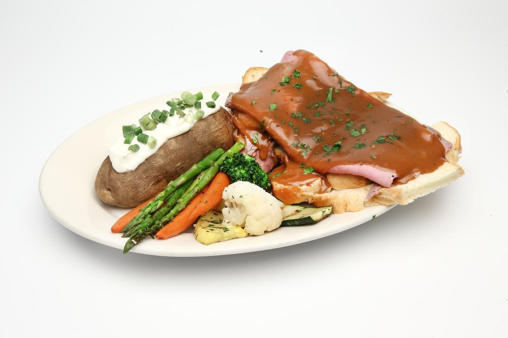 Hot Open Roast Beef Dinner · 8 oz. fresh meat, served on white bread, topped with brown gravy.

Comes with Mashed or Baked Potato and Grilled Veggies