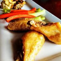 Wings · Fried or grilled. Bone-in chicken wings, tossed in your choice of sauce, served with 1 addit...