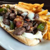 Hand Cut Steak and Cheese Sub · Seasoned steak served in a sub roll with American cheese. Add bacon, peppers, onions, mushro...