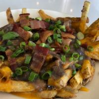 SOMO disco fries · Shredded short rib, bacon, scallions, gravy and cheddar.