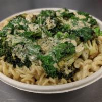 Mac + Greens Bowl · Our classic cashew mac + cheese topped with seasoned grilled kale, broccoli, and peas.