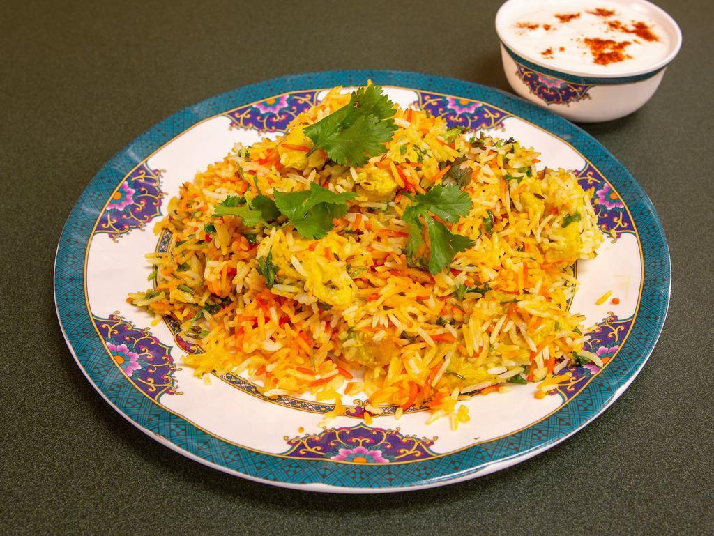 Chicken Biryani · Aromatic spicy basmati rice dish prepared by cooking rice with chicken and assortment of spices.