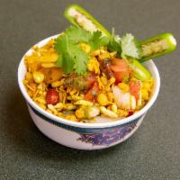 Bhel · A mixture of puffed rice, potatoes, onions and assorted chutneys.