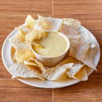Queso Dip and Chips · A mixture of lots of cheese, pico, jalapeno cream cheese, and chorizo. Authentic Mexican str...
