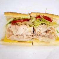 Turkey sub · oven roast turkey breast and cheese, lettuce, tomato and onions with  choice of dressing (ma...