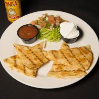 Quesadilla · Tortilla stuffed with pepper Jack and cheddar, topped with sour cream and green onion, with ...