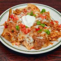 Nacho Especial · Nachos topped with your choice of grilled chicken, ground beef or beans. Add steak for an ad...