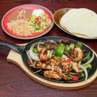 Grilled Fajita Combo · Grilled chicken, grilled steak and grilled shrimp. Add chorizo for an additional charge.
