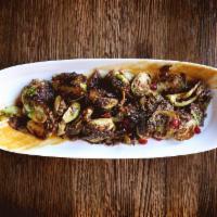 Charred Brussels Sprouts · White miso and pomegrante.
