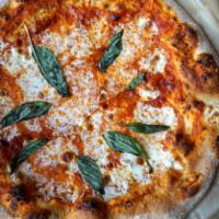 Classic Margherita Pizza · tomato sauce, fresh mozzarella, extra virgin olive oil, basil