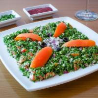 Tabouli Salad · Thinly chopped fresh parsley, tomatoes, onions, bulgur wheat, spices and salt, lemon juice a...