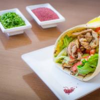 Shawarma Chicken Jumbo Wrap · Layered strips of marinated chicken delicately spiced and slow grilled. Served in pita bread...