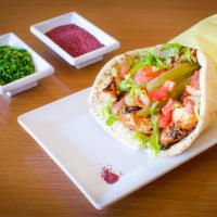 Tekah Chicken Jumbo Wrap · Marinated and spiced cubes of chicken tenders grilled to perfection over fire. Served in pit...
