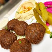 Falafel Plate · Served with hummus, turnips, pickles and pita bread.
