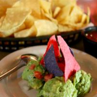 Guacamole · Mashed avocadoes with cilantro and lime topped with pico de gallo.