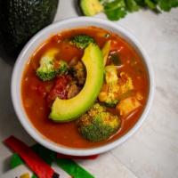 Tortilla Soup · Tomato based, corn, vegetables, tortilla strips and avocado slice. Vegan.