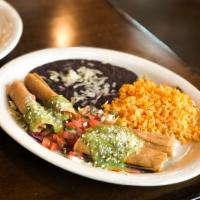 Chicken Flautas · Garnished with lettuce, pico de gallo and guacamole sauce topped with Parmesan and served wi...
