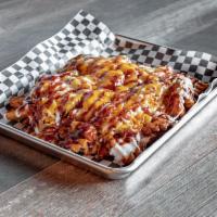 Pulled Pork Loaded Fries · Our tender, slow-cooked pulled pork with white Cheddar cheese sauce and crumbled bacon drizz...