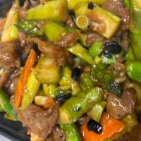Asparagus Beef · Tender sliced beef with asparagus and carrots stir fried in a black bean sauce.