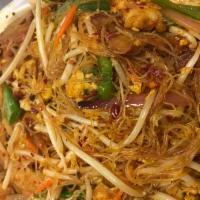 Singapore Curry Noodle · Thin rice noodles with veggies, BBQ pork, chicken and shrimp in ayellow curry stir fry. Hot ...
