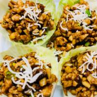 Chicken Lettuce Wrap · Minced chicken with mushroom, water chestnuts and green onion in a house stir fry served wit...