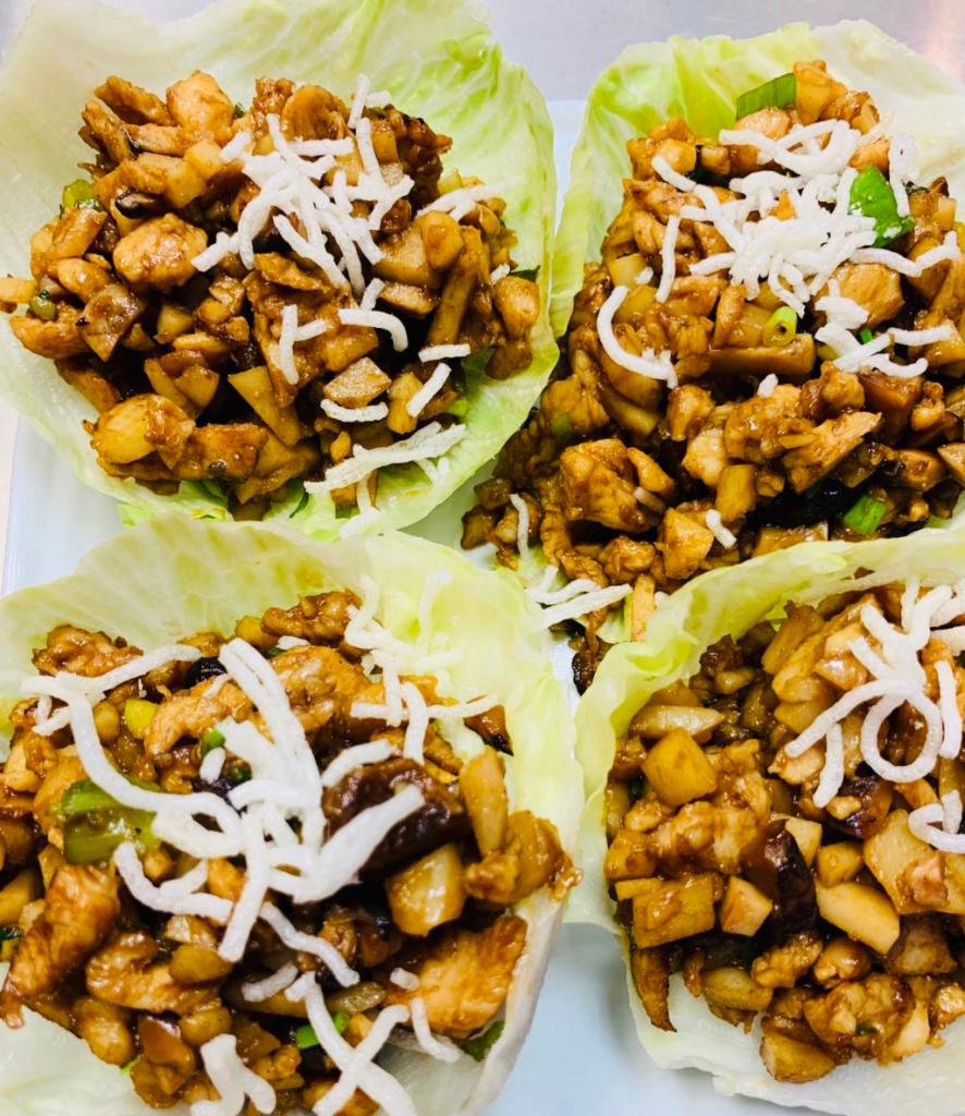 Chicken Lettuce Wrap · Minced chicken with mushroom, water chestnuts and green onion in a house stir fry served with lettuce wraps.