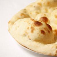 Plain Naan · Unleavened bread baked in the clay oven at a special temperature.