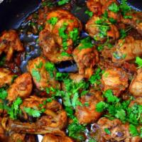 Chicken Karahi · Diced chicken cooked with spices tomatoes in traditional style.